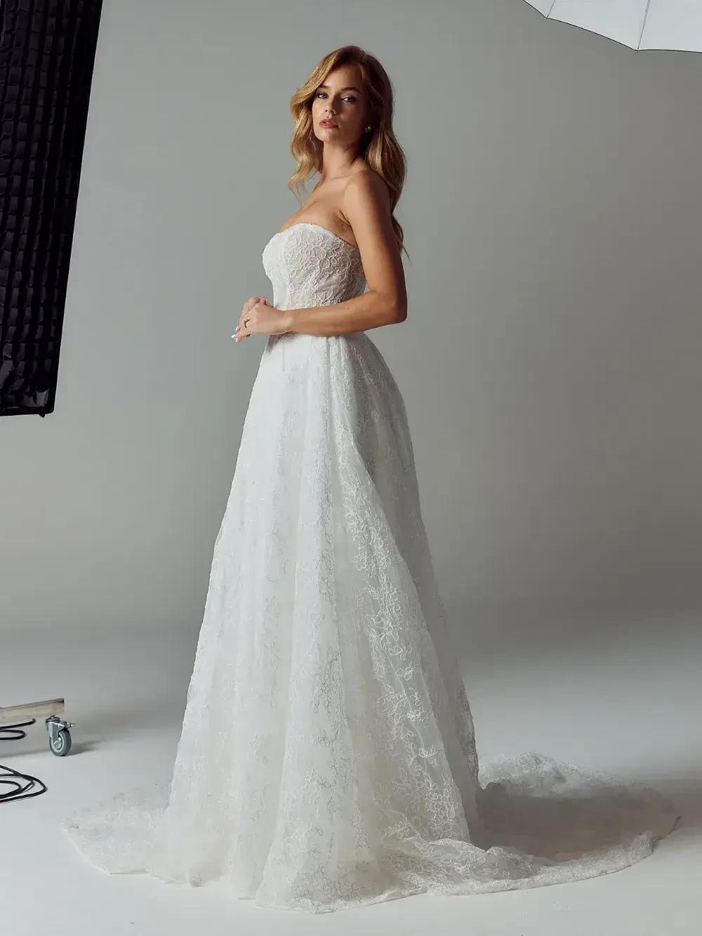 model is wearing a sleeveless bridal gown