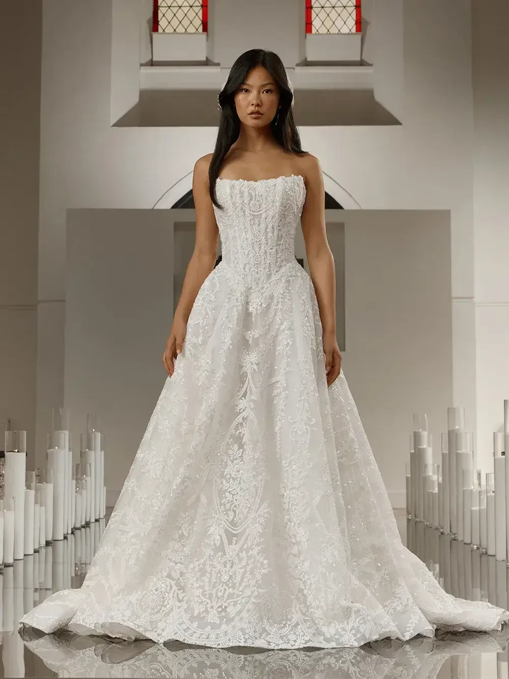 model is wearing a strapless a-line bridal gown