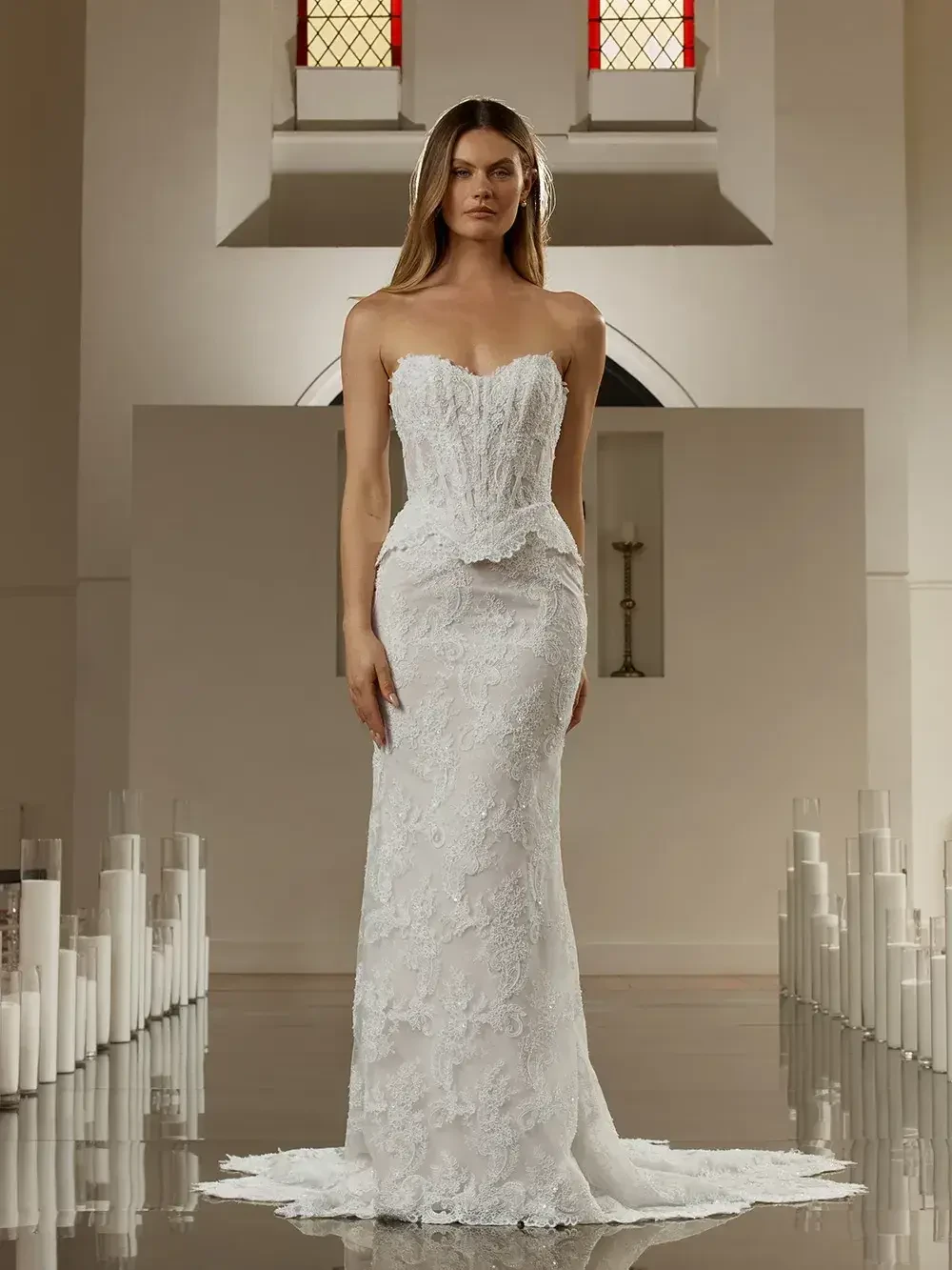 model is wearing a strapless fit and flare wedding gown