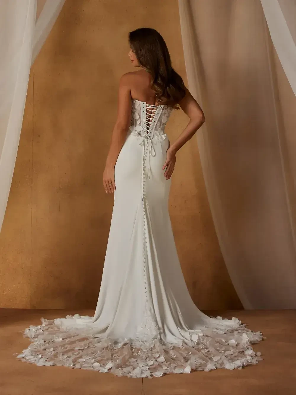 model is wearing a strapless bridal gown